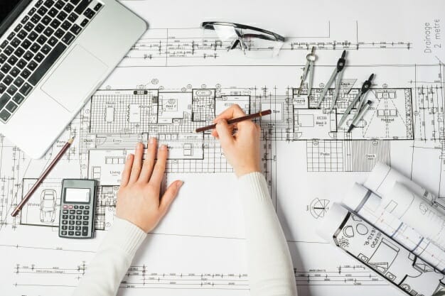 hands-of-drawing-architect_23-2147710937
